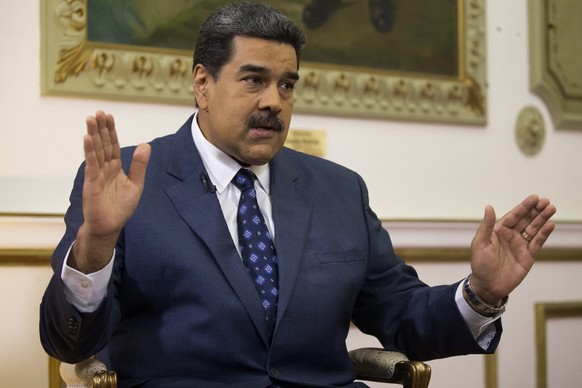 Venezuela&#039;s President Nicolas Maduro speaks during an interview with The Associated Press at Miraflores presidential palace in Caracas, Venezuela, Thursday, Feb. 14, 2019. Maduro is inviting a U. ...