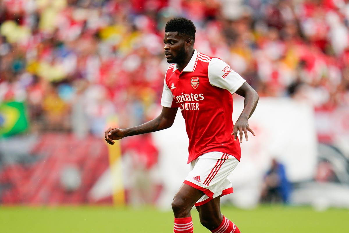 FILE - Arsenal midfielder Thomas Partey runs with the ball against Everton during the first half of a pre-season friendly soccer match, Saturday, July 16, 2022, in Baltimore. (AP Photo/Julio Cortez, F ...
