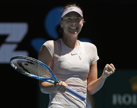 Russia&#039;s Maria Sharapova celebrates after she won over Germany&#039;s Tatjana Maria during their first round match at the Australian Open tennis championships in Melbourne, Australia, Tuesday, Ja ...