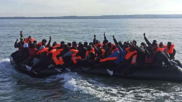 This photo provided by the Prefecture Maritime du Nord et de la Manche shows migrants continuing their journey to Britain off northern France coast, Tuesday, April 23, 2024. Five people, including a c ...