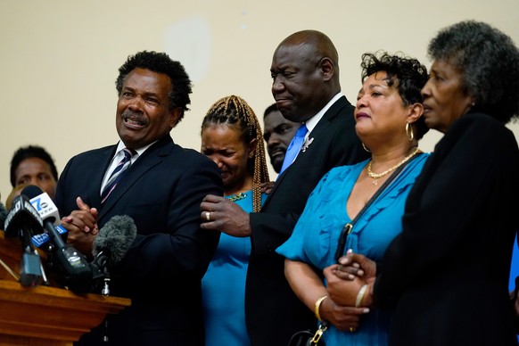 Garnell Whitfield Jr., left, the son of Ruth Whitfield, a victim of shooting at a supermarket, speaks with members of the media during a news conference in Buffalo, N.Y., Monday, May 16, 2022. (AP Pho ...