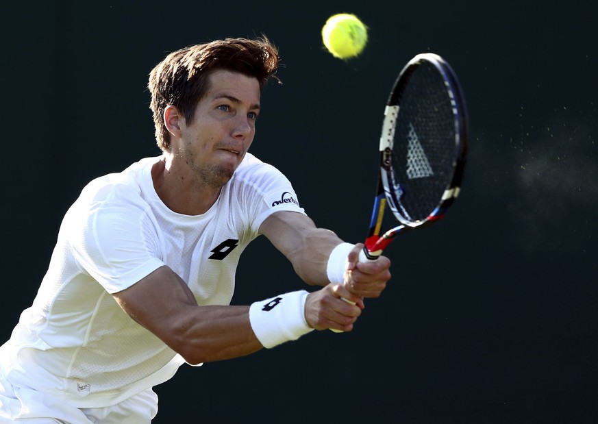 Britain&#039;s Aljaz Bedene returns a ball to Croatia&#039;s Ivo Karlovic during their Men&#039;s Singles Match on day one at the Wimbledon Tennis Championships in London Monday, July 3, 2017. (Gareth ...