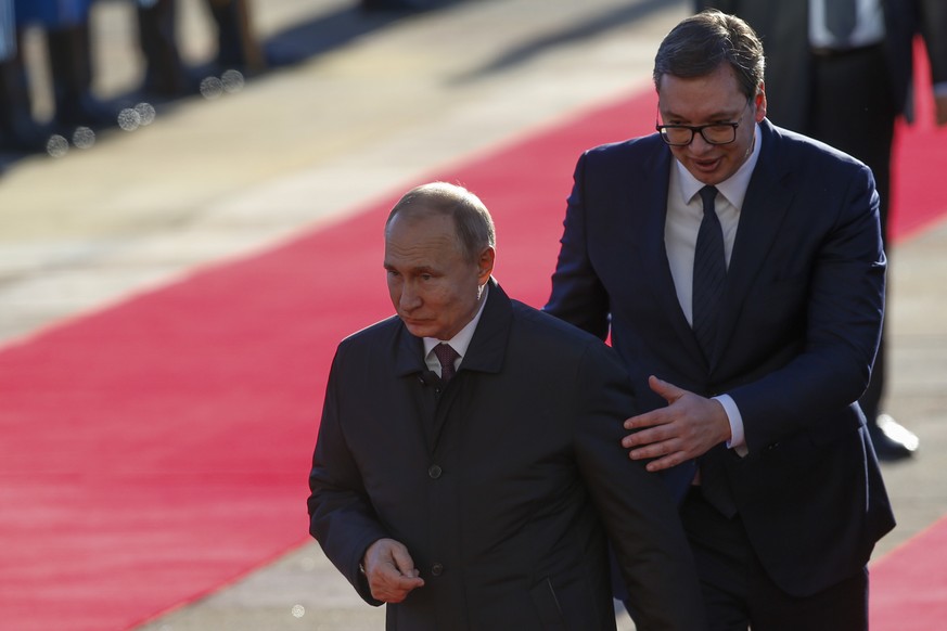 FILE - Serbian President Aleksandar Vucic, right, welcomes Russian President Vladimir Putin for the talks in Belgrade, Serbia, Thursday, Jan. 17, 2019. Issuing an international arrest warrant for Russ ...