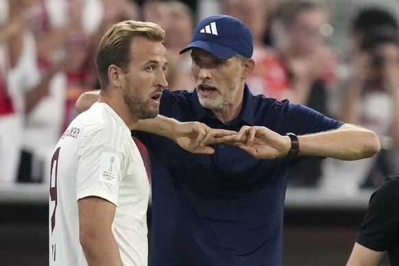 FILE - Then Bayern&#039;s head coach Thomas Tuchel talks to Bayern&#039;s Harry Kane during the German Super Cup final between FC Bayern Munich and RB Leipzig at the Allianz Arena stadium in Munich, G ...