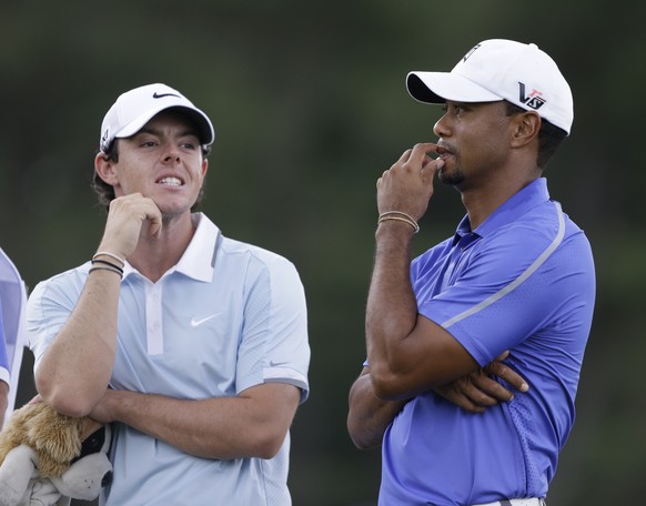 Rory McIlroy (l.) und Tiger Woods.