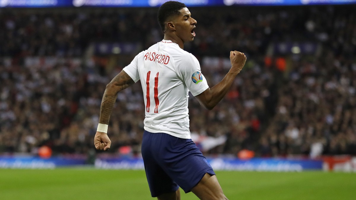 England's Marcus Rashford celebrates scoring his side's fourth goal during the Euro 2020 group A qualifying soccer match between England and Montenegro at Wembley stadium in London, Thursday ...