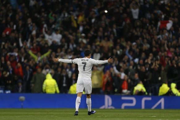 Real Madrid&#039;s Cristiano Ronaldo celebrates scoring during the Champions League 2nd leg quarterfinal soccer match between Real Madrid and VfL Wolfsburg at the Santiago Bernabeu stadium in Madrid,  ...