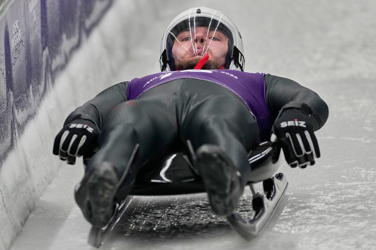 Individual Neutral Athlete Pavel Repilov starts for a men's single luge training session at the 2026 Winter Olympics, in Cortina d'Ampezzo, Italy, Friday, Feb. 6, 2026. (AP Photo/Aijaz Rahi) ...