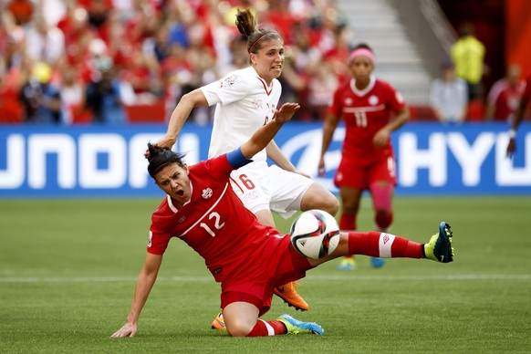 Canada&#039;s Christine Sinclair, left, fights for the ball with Switzerland&#039;s Selina Kuster, right, during the the round of 16 match between Canada and Switzerland at the BC Place Stadium, in Va ...