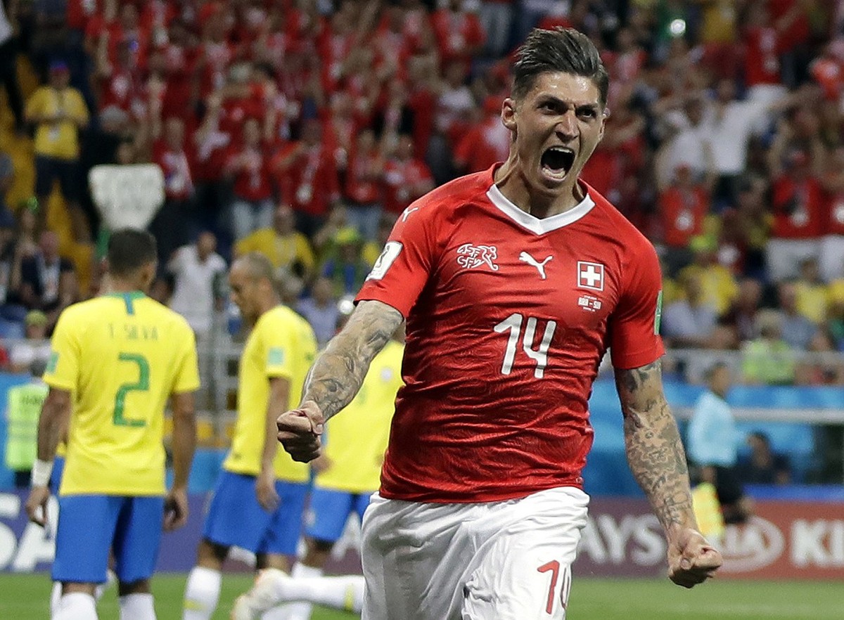 Switzerland's Steven Zuber celebrates after scoring his side's opening goal during the group E match between Brazil and Switzerland at the 2018 soccer World Cup in the Rostov Arena in Rostov ...