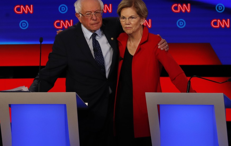 Sen. Bernie Sanders, I-Vt., and Sen. Elizabeth Warren, D-Mass., embrace after the first of two Democratic presidential primary debates hosted by CNN Tuesday, July 30, 2019, in the Fox Theatre in Detro ...