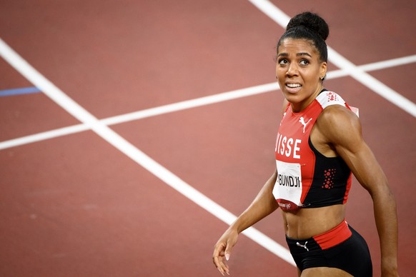 epa09391760 Mujinga Kambundji of Switzerland reacts after competing in the women&#039;s 200m final at the Athletics events of the Tokyo 2020 Olympic Games at the Olympic Stadium in Tokyo, Japan, 03 Au ...