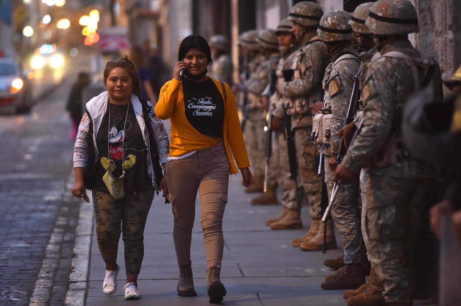 epa10366586 Soldiers guard the streets in the center of Arequipa, Peru, 14 December 2022. The Government of the Peruvian president Dina Boluarte decreed a State of Emergency at the national level for  ...