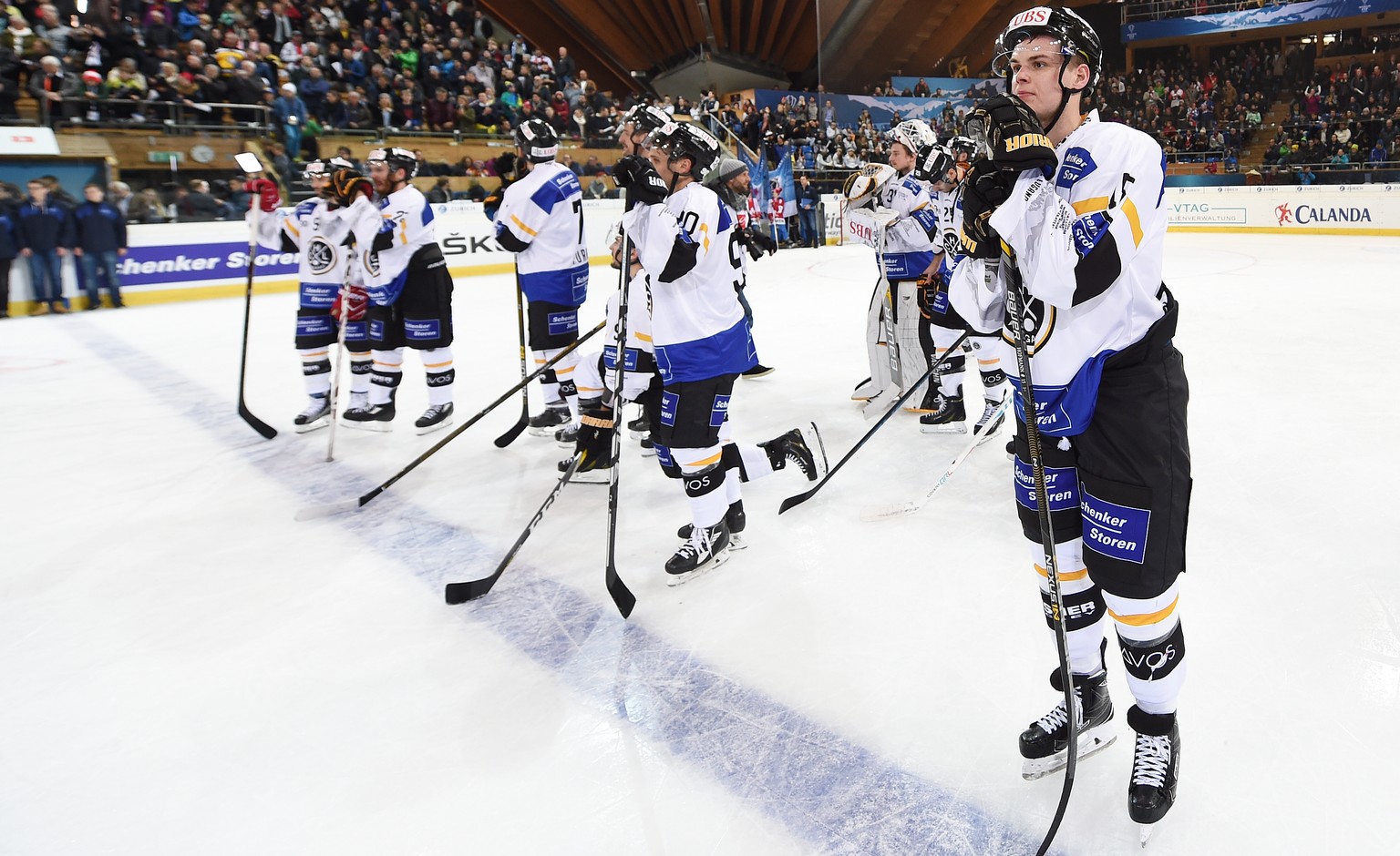 Luganos Gregory Hofmann and the team react after losing the final game between Team Canada and Switzerlands HC Lugano at the 90th Spengler Cup ice hockey tournament in Davos, Switzerland, Saturday, De ...