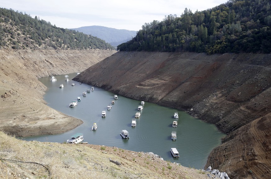 FILE - In this Thursday, Oct. 30, 2014 file photo, houseboats sit in the drought lowered waters of Oroville Lake, near Oroville, Calif. Gov. Jerry Brown declared an end to California&#039;s historic d ...