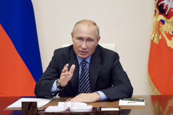 Russian President Vladimir Putin gestures during a video conference meeting at the Novo-Ogaryovo residence outside Moscow in Moscow, Russia, Thursday, July 9, 2020. (Alexei Druzhinin, Sputnik, Kremlin ...