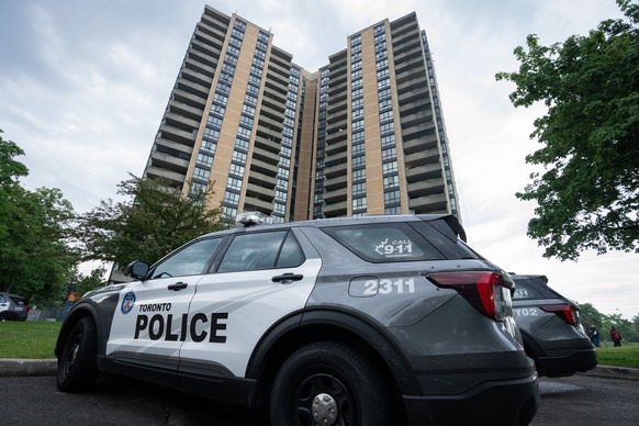 Investigators work the scene where a Toronto Police officer was shot in Toronto on Thursday, June 11, 2026. (Arlyn McAdorey/The Canadian Press via AP)
Canada Toronto Shooting