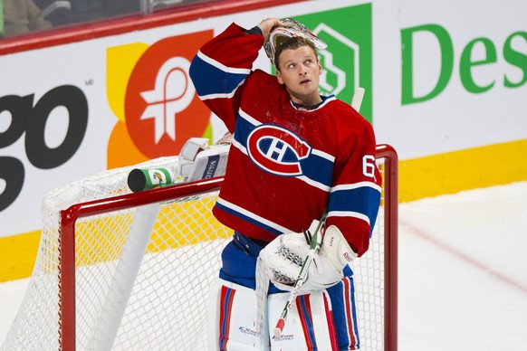 Bildnummer: 14509733 Datum: 16.09.2013 Copyright: imago/Icon SMI
16 September 2013: Goaltender Robert Mayer 65 of the Montreal Canadiens removes his mask during the NHL Eishockey Herren USA preseason ...