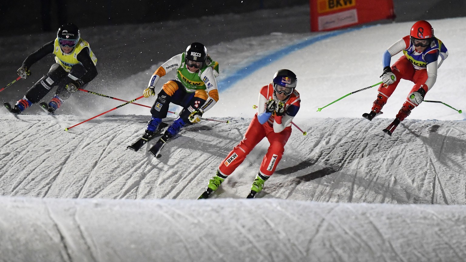 Brittany Phelan of Canada, Sandra Naeslund of Sweden, Fanny Smith of Switzerland, and Sixtine Cousin of Switzerland, from left, speed down the track during the semi finals of the Ski Cross World Cup i ...