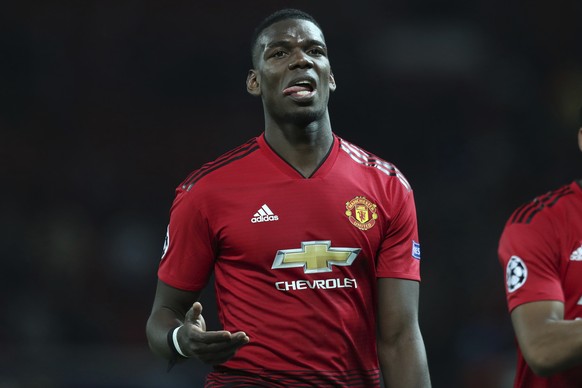 FILE - In this April 10, 2019, file photo, Manchester United's Paul Pogba reacts after the Champions League quarterfinal, first leg, soccer match between Manchester United and FC Barcelona at Old Traf ...