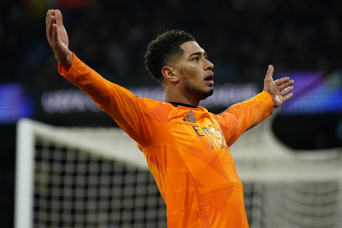 Real Madrid's Jude Bellingham celebrates after scoring his sides third goal during the Champions League playoff first leg soccer match between Manchester City and Real Madrid at the Etihad Stadiu ...