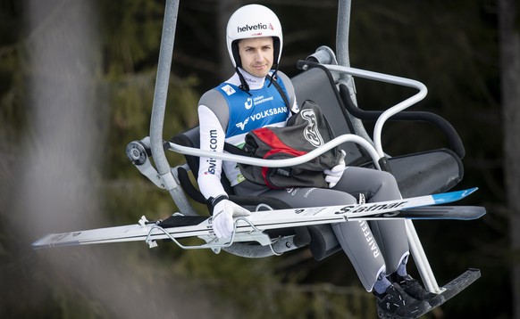 epa08219409 Simon Ammann of Switzerland sits on a chairlift ahead of a practice round for the Kulm Ski Flying World Cup competition in Bad Mitterndorf, Austria, 15 February 2020. EPA/CHRISTIAN BRUNA