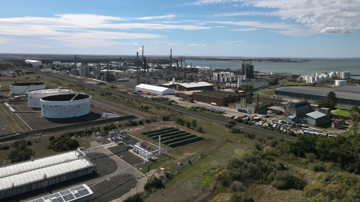 This photo shows an aerial view of the Viva Oil Refinery in Geelong on April 16, 2026 following an overnight fire with authorities warning of disruptions to domestic fuel supply. Towering columns of f ...