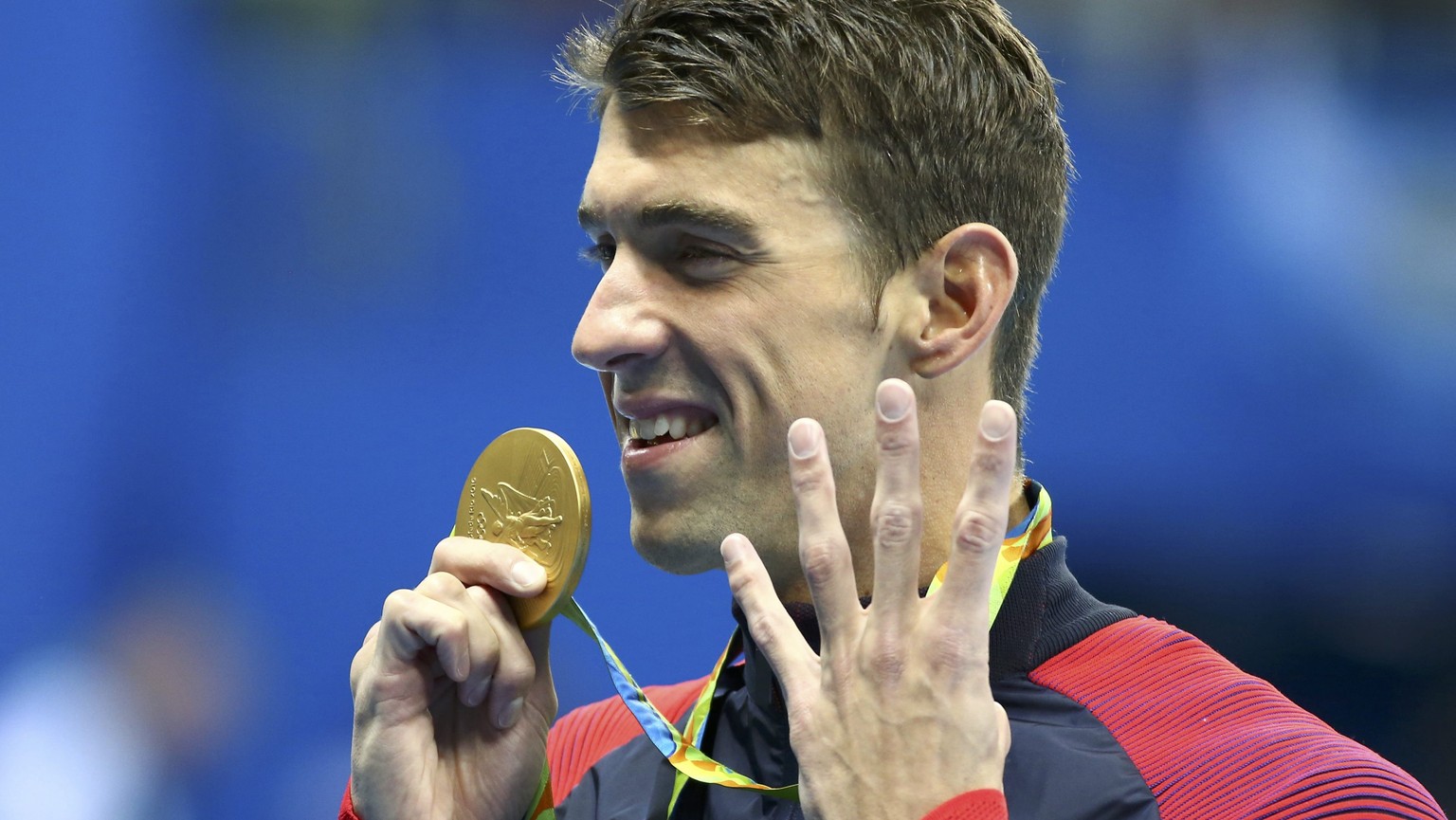 2016 Rio Olympics - Swimming - Victory Ceremony - Men&#039;s 200m Individual Medley Victory Ceremony - Olympic Aquatics Stadium - Rio de Janeiro, Brazil - 11/08/2016. Michael Phelps (USA) of USA gestu ...