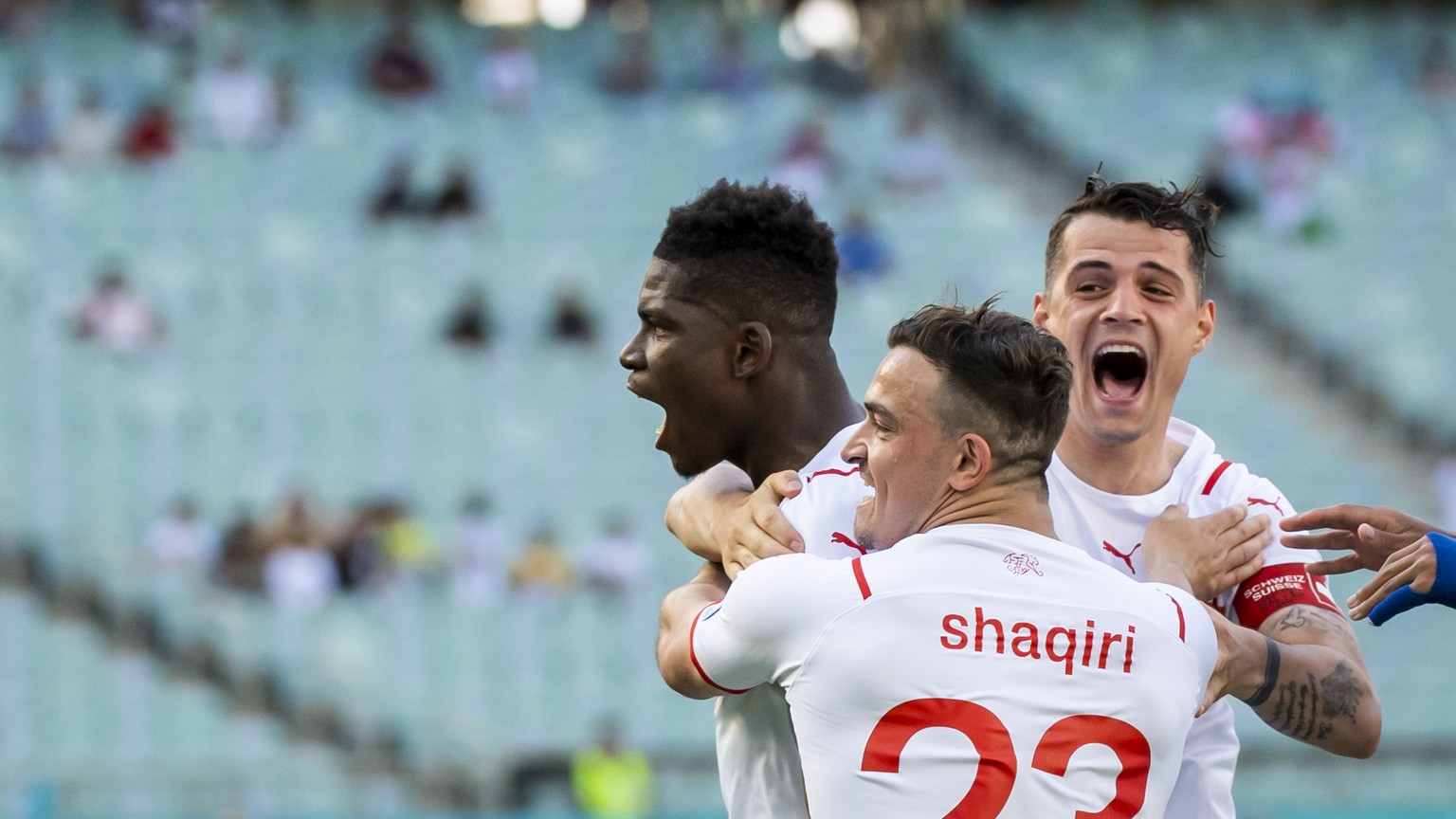 Switzerland's forward Breel Embolo, left, celebrates his goal with Switzerland's midfielder Xherdan Shaqiri and Switzerland's midfielder Granit Xhaka during the Euro 2020 soccer tournament group A mat ...