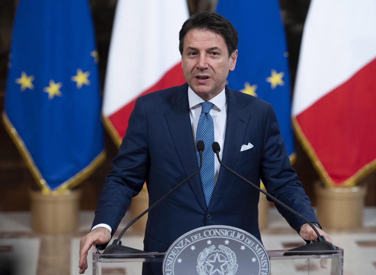 epa07753356 Italy's premier Giuseppe Conte attends a press conference prior to a working lunch with President-elect of the European Commission Ursula von der Leyen (not pictured) at Chigi Palace  ...