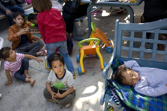 epa06826138 A child from the Mexican state of Michoacan looks on while sitting in the patio of the Centro Madre Assunta, a shelter for migrant women and children, in Tijuana, Mexico, 20 June 2018 (iss ...