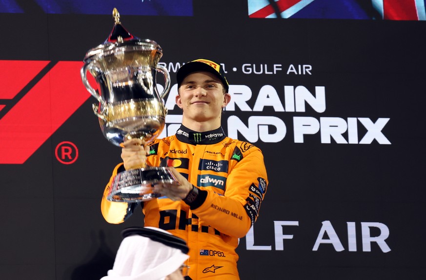 epa12030257 Winner McLaren driver Oscar Piastri of Australia celebrates with his trophy after winning the Formula One Bahrain Grand Prix in Sakhir, Bahrain, 13 April 2025. EPA/ALI HAIDER