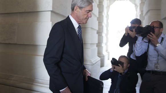 epa06369178 (FILE) - Special Counsel and Former FBI Director Robert Mueller (C) leaves after briefing members of the Senate Judiciary Committee on the investigation into Russia&#039;s interference in  ...