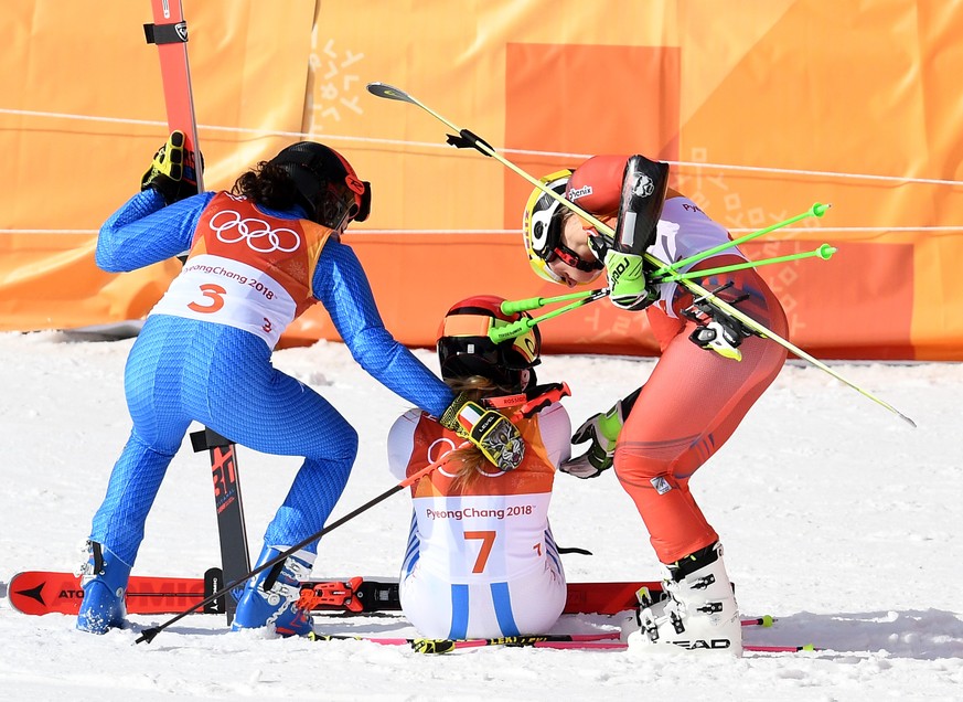 epa06527059 (R-L) Silver medal winner Ragnhild Mowinckel of Norway, gold medal winner Mikaela Shiffrin of the USA, bronze medal winner Federica Brignone of Italy react after the Women&#039;s Giant Sla ...