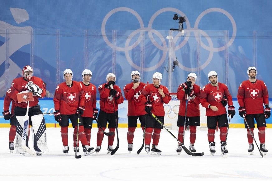 Switzerland&#039;s players look disappointed after losing against Denmark team, during the men&#039;s ice hockey preliminary round game between Switzerland and Denmark at the Wukesong Sports Centre at ...