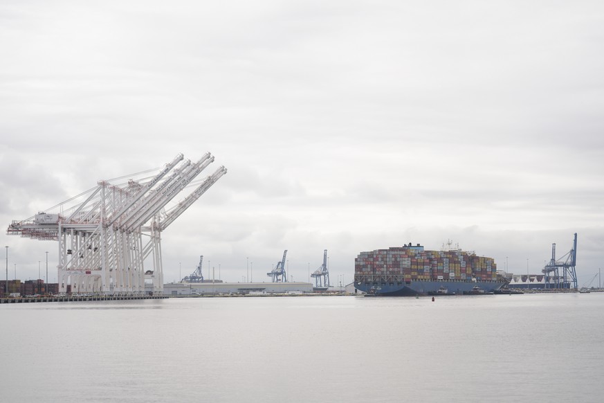 Tugboats escort the container ship Dali after it was refloated in Baltimore, Monday, May 20, 2024. The recovery from the deadly Baltimore bridge collapse reached a significant milestone Monday as the  ...
