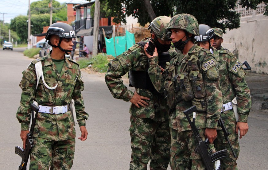 epa09275039 Soldiers carry out a patrol in the surroundings of a base used by the 30th Army Brigade after the explosion of a car bomb, in Cucuta, Colombia, 15 June 2021. A car bomb exploded on Tuesday ...