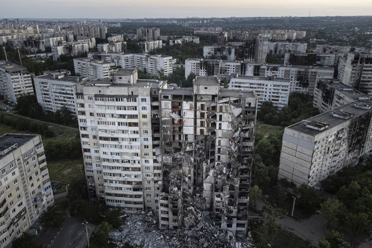 An apartment building damaged by Russian attack is seen in Kharkiv, Ukraine, on Monday, July 4, 2022. The Ukrainian military's General Staff says that Russian forces are trying to press their off ...