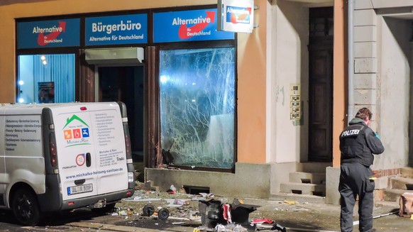 epa07260800 Authorities work at a Alternative fuer Deutschland (AfD) party&#039;s citizen office after an explosion took place in Doebeln, Germany, 03 January 2019. Media reports, explosive detonated  ...