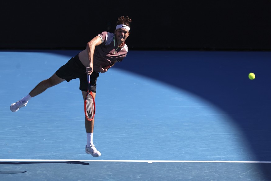 Taylor Fritz of the U.S. serves to Hugo Gaston of France during their second round match at the Australian Open tennis championships at Melbourne Park, Melbourne, Australia, Wednesday, Jan. 17, 2024.  ...