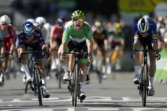 FILE - Britain&#039;s Mark Cavendish, wearing the best sprinter&#039;s green jersey, celebrates as he crosses the finish line to win the thirteenth stage of the Tour de France cycling race over 219.9  ...