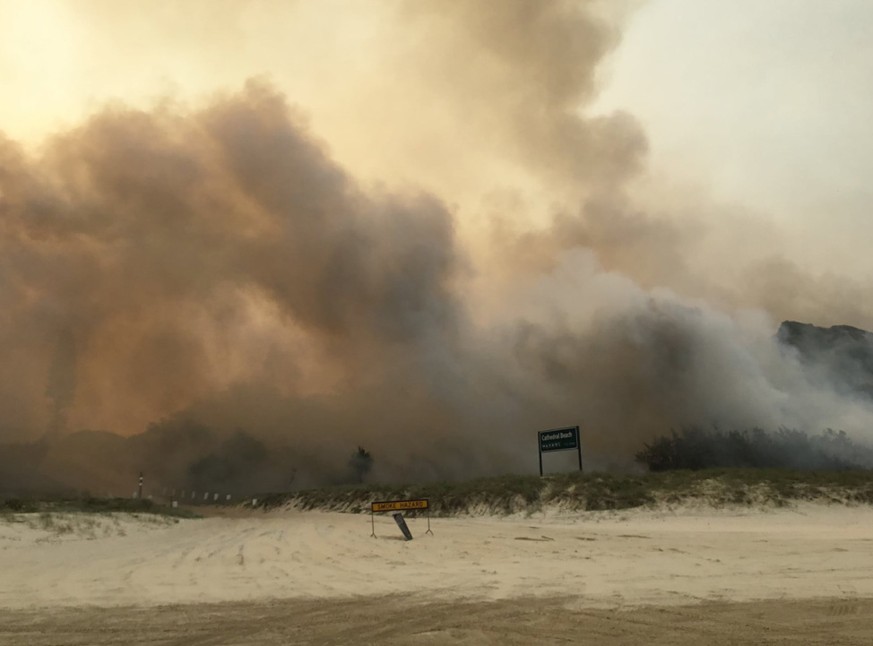 A supplied image obtained on Monday, December 7, 2020, the K&#039;gari (Fraser Island) bushfire seen outside the Cathedrals camping ground, on Fraser Island. TA dangerous bushfire is within a few hund ...