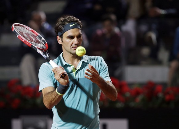 Roger Federer, of Switzerland, prepares to serve the ball to his compatriot Stan Wawrinka during a semifinal match at the Italian Open tennis tournament, in Rome, Saturday, May 16, 2015. Federer beat  ...