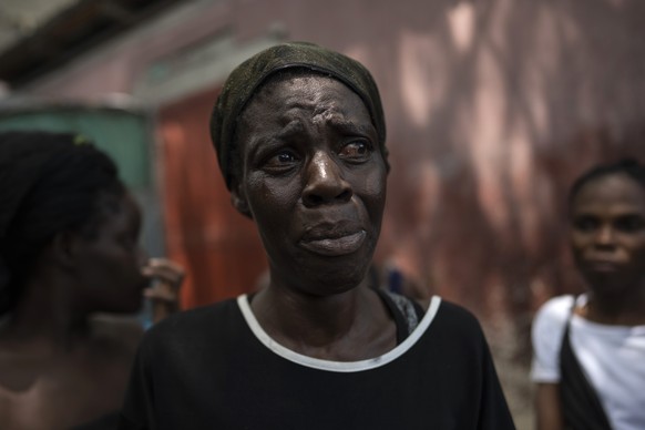 Dieu Frisdeline, who has sought refuge in Jean-Kere Almicar&#039;s front yard, cries as she tells how she was raped by gang members, in Port-au-Prince, Haiti, Sunday, June 4, 2023. Nearly 200 people w ...