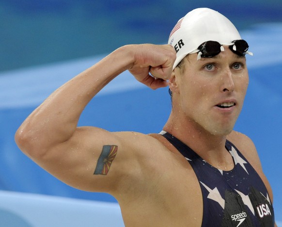 FILE - In this Tuesday, Aug. 12, 2008 file photo, United States&#039; relay swimmer Klete Keller reacts after a men&#039;s 4x200-meter freestyle relay heat during the swimming competitions in the Nati ...