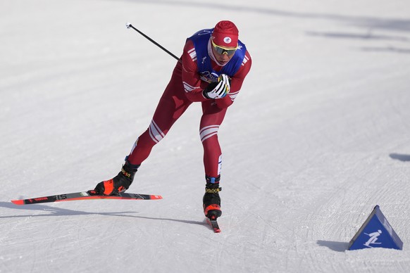 Russian athlete Alexander Bolshunov competes during the men&#039;s weather-shortened 50km mass start free cross-country skiing competition at the 2022 Winter Olympics, Saturday, Feb. 19, 2022, in Zhan ...