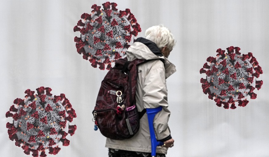 A woman passes a coronavirus test center in Duisburg, Germany, Tuesday, Oct. 12, 2021. Germany ended free rapid corona tests for all this week. Tests remain free only for some groups, like young child ...