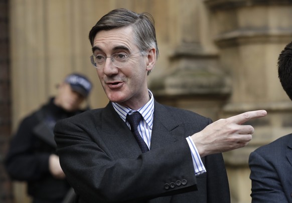 Pro-Brexit, Conservative lawmaker Jacob Rees-Mogg gestures as he speaks to the media outside the Houses of Parliament in London, Thursday, Nov. 15, 2018. A pro-Brexit group of Conservative lawmakers s ...