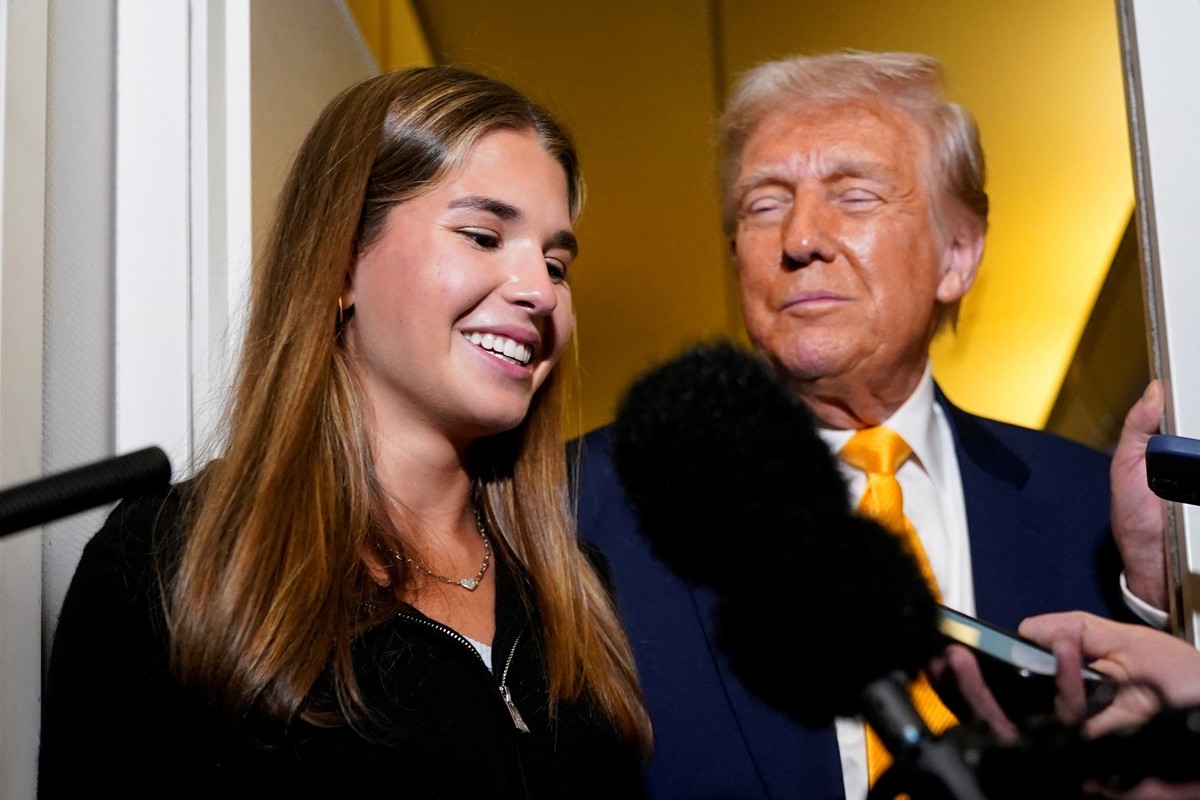 U.S. President Donald Trump's granddaughter Kai Madison Trump speaks to the media on board Air Force One on the way to West Palm Beach, Florida, U.S., April 13, 2025. REUTERS/Nathan Howard
