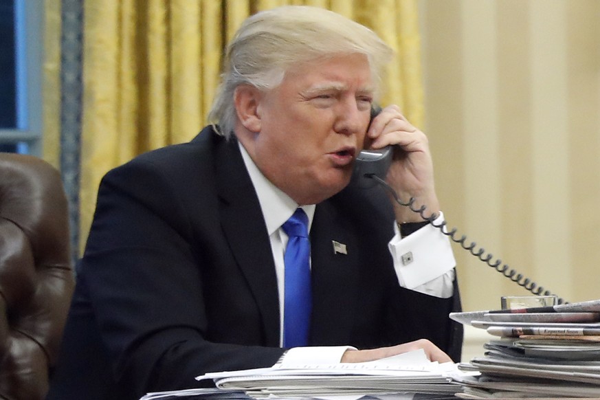 FILE - In this Jan. 28, 2017, file photo, President Donald Trump speaks on the phone with Prime Minister of Australia Malcolm Turnbull in the Oval Office of the White House in Washington. Trump, who b ...